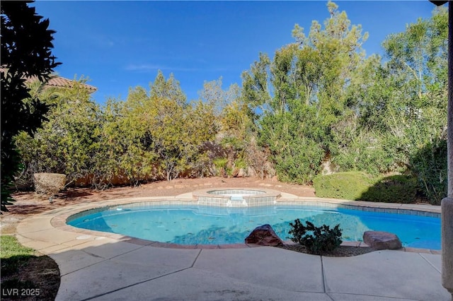 view of pool with a pool with connected hot tub