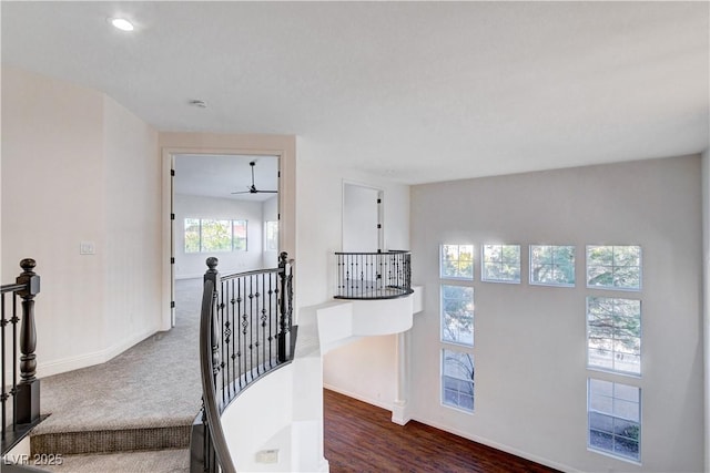 stairway with carpet floors and baseboards