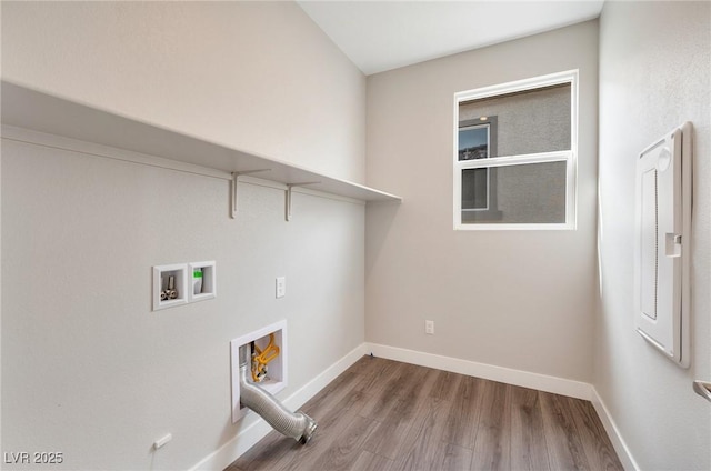 laundry area with laundry area, hookup for a washing machine, baseboards, and wood finished floors