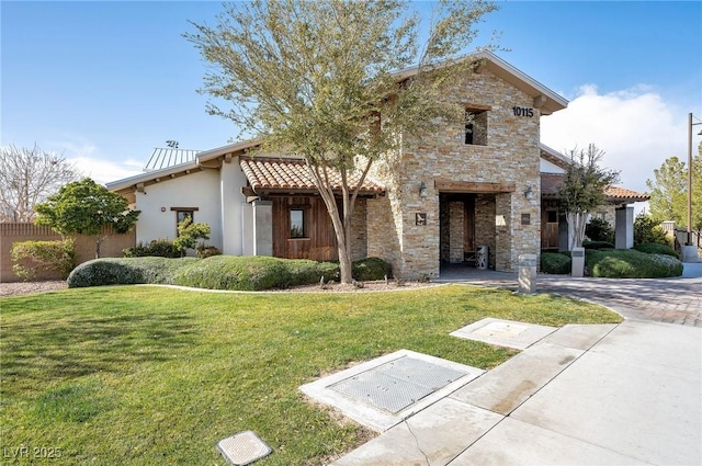 view of front of property with stone siding, a front lawn, decorative driveway, and stucco siding