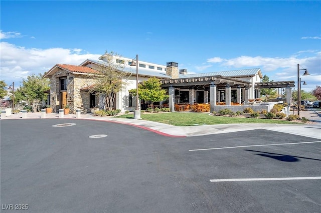 view of property featuring uncovered parking