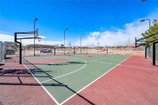 view of sport court featuring community basketball court and fence