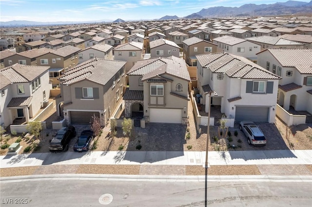 birds eye view of property with a residential view and a mountain view