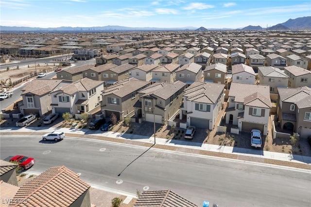 birds eye view of property with a mountain view and a residential view