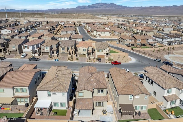 bird's eye view featuring a residential view and a mountain view