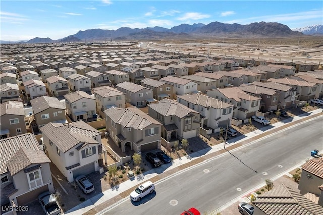 drone / aerial view with a residential view and a mountain view