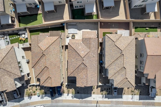 birds eye view of property with a residential view