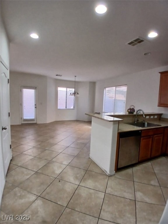 kitchen featuring recessed lighting, visible vents, stainless steel dishwasher, light tile patterned flooring, and a sink