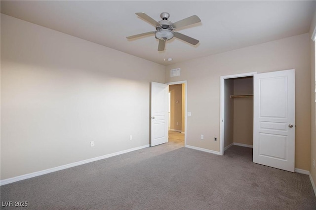 unfurnished bedroom featuring ceiling fan, a closet, carpet, and baseboards