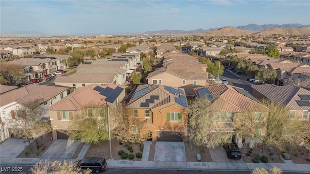 birds eye view of property with a mountain view and a residential view