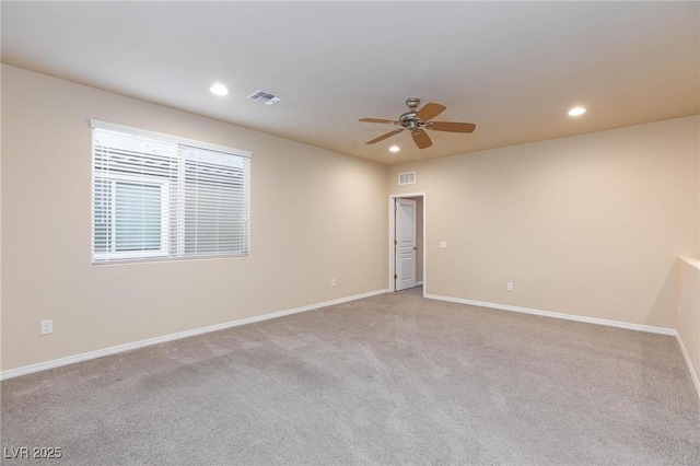 unfurnished room featuring light colored carpet, visible vents, and recessed lighting