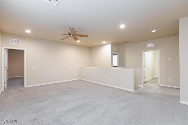 empty room with baseboards, visible vents, and recessed lighting