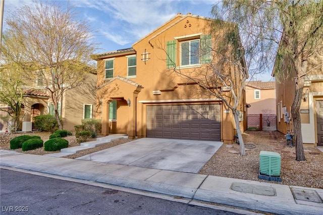 view of front of house featuring driveway, a tile roof, an attached garage, fence, and stucco siding