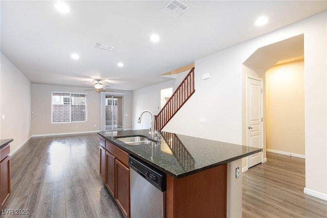 kitchen featuring recessed lighting, visible vents, stainless steel dishwasher, a sink, and light wood-type flooring