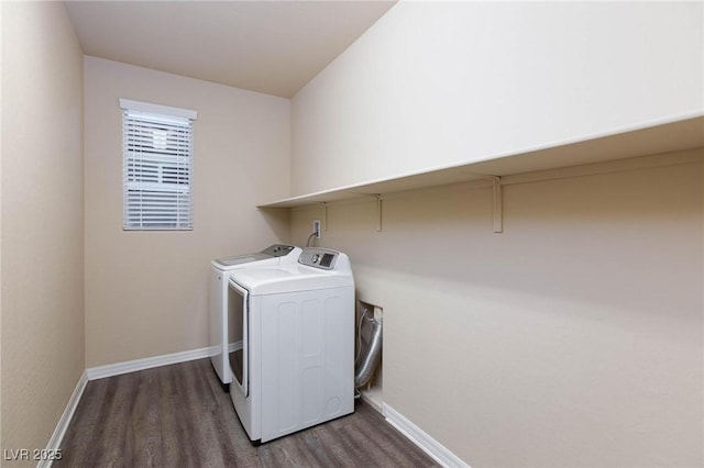 laundry area with laundry area, baseboards, dark wood-type flooring, and independent washer and dryer