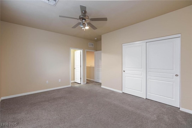 unfurnished bedroom featuring carpet floors, a closet, visible vents, and baseboards