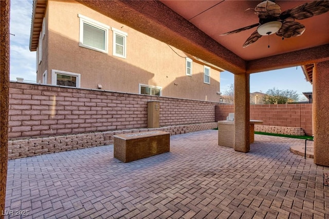 view of patio / terrace featuring a fenced backyard and a ceiling fan