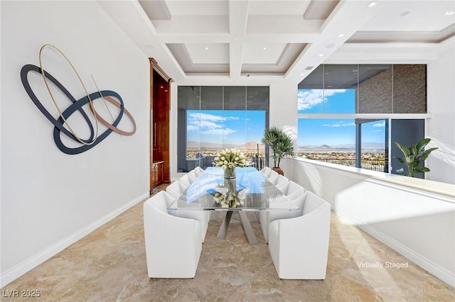 dining area featuring a high ceiling, baseboards, coffered ceiling, and beam ceiling