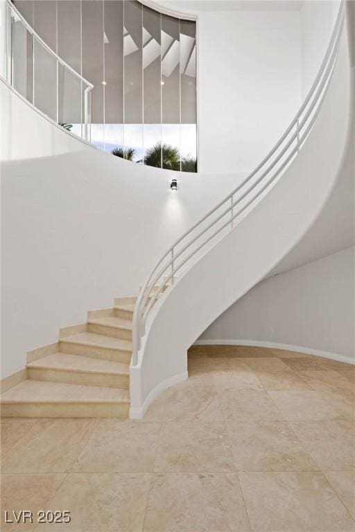 stairway with a towering ceiling