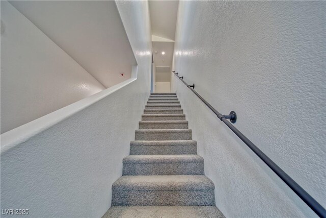 stairs with a textured wall