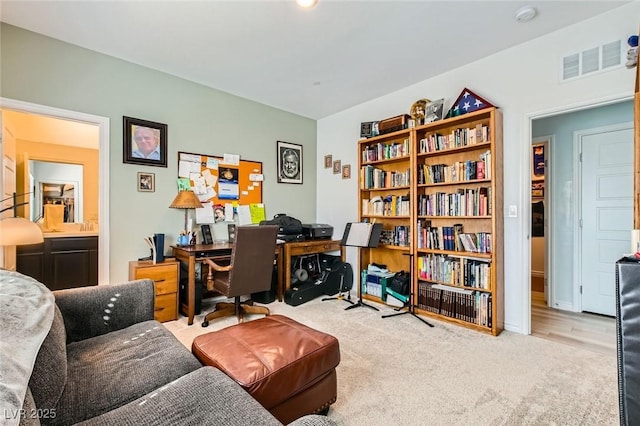 carpeted office featuring visible vents