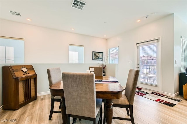 dining area with recessed lighting, visible vents, and light wood finished floors