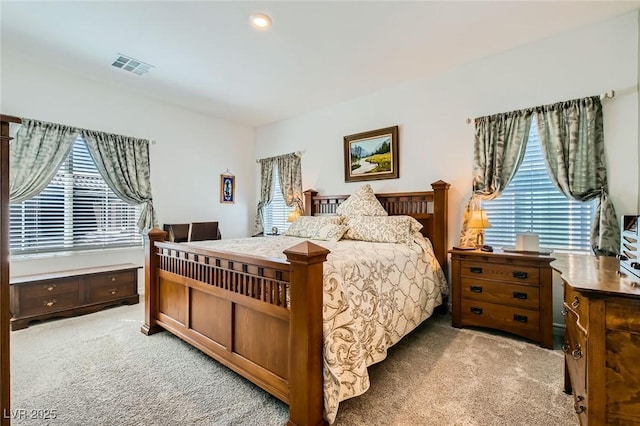 bedroom featuring visible vents and carpet