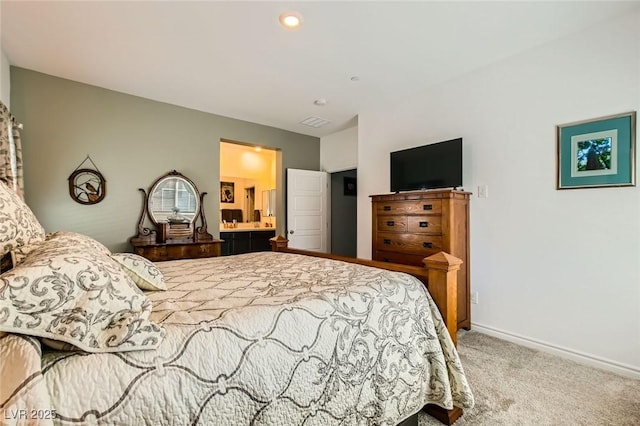 bedroom featuring carpet flooring, visible vents, ensuite bathroom, and baseboards