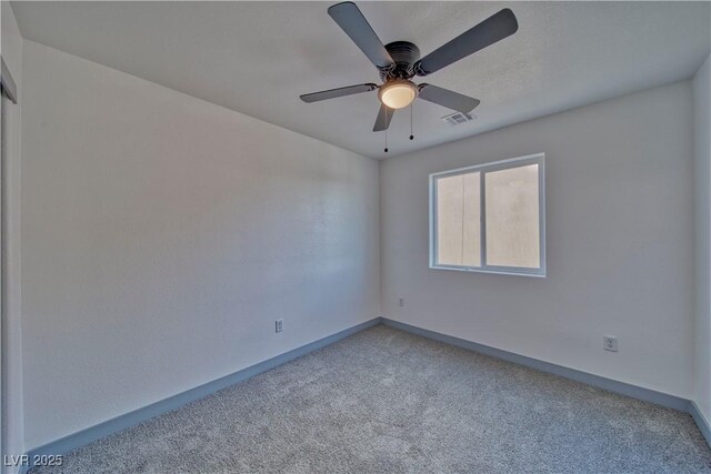 384 E Erin St Unit 3, Pahrump, NV 89048 - empty room featuring carpet floors, baseboards, visible vents, and ceiling fan