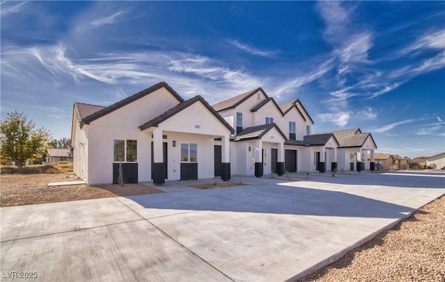 modern farmhouse featuring stucco siding