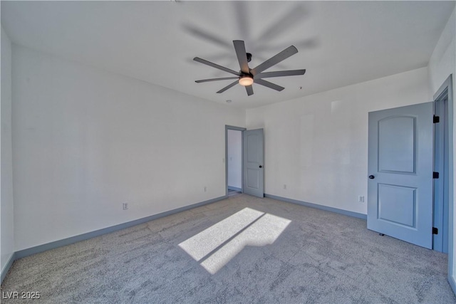 unfurnished bedroom with ceiling fan, carpet flooring, and baseboards