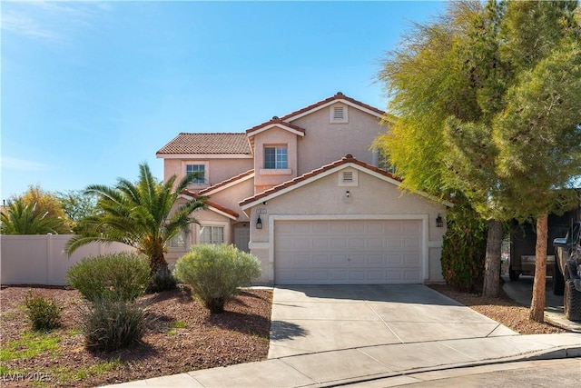 mediterranean / spanish-style house with stucco siding, fence, a garage, driveway, and a tiled roof