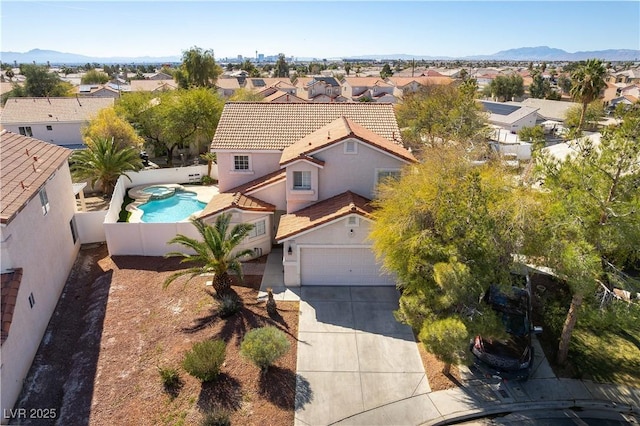 aerial view featuring a mountain view and a residential view