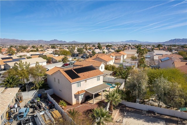 birds eye view of property with a residential view and a mountain view