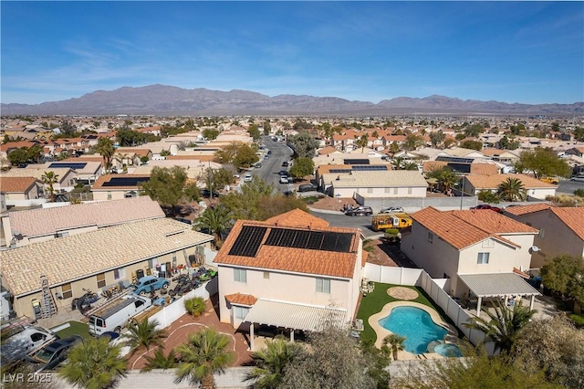 birds eye view of property with a mountain view and a residential view