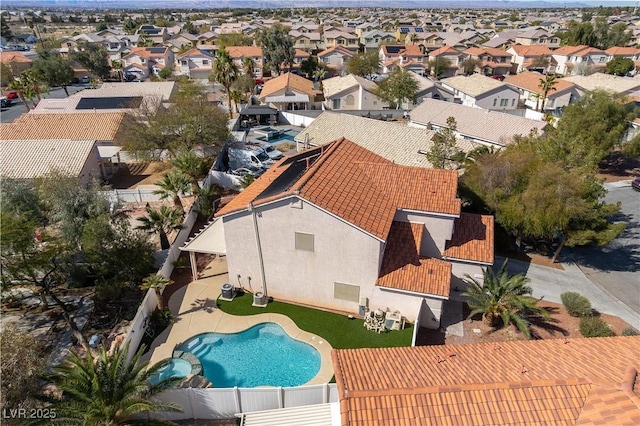 view of swimming pool with a fenced backyard and a residential view