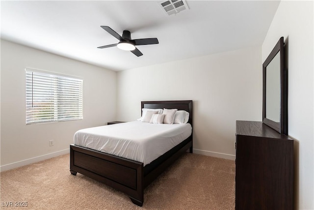 bedroom with baseboards, visible vents, ceiling fan, and light colored carpet