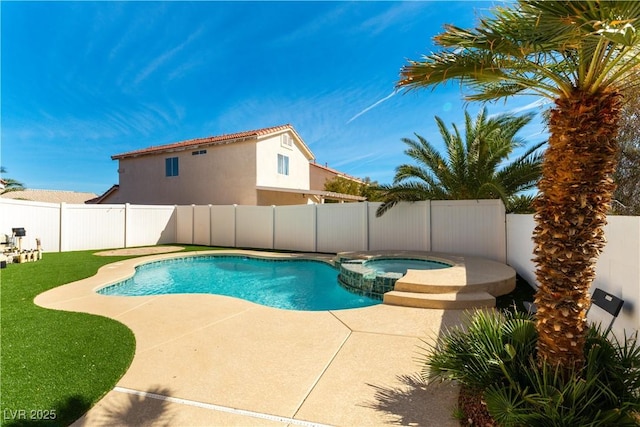 view of pool featuring a pool with connected hot tub, a fenced backyard, a yard, and a patio