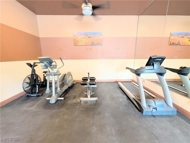 workout room with a ceiling fan and baseboards