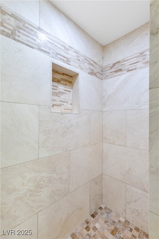 bathroom featuring tiled shower