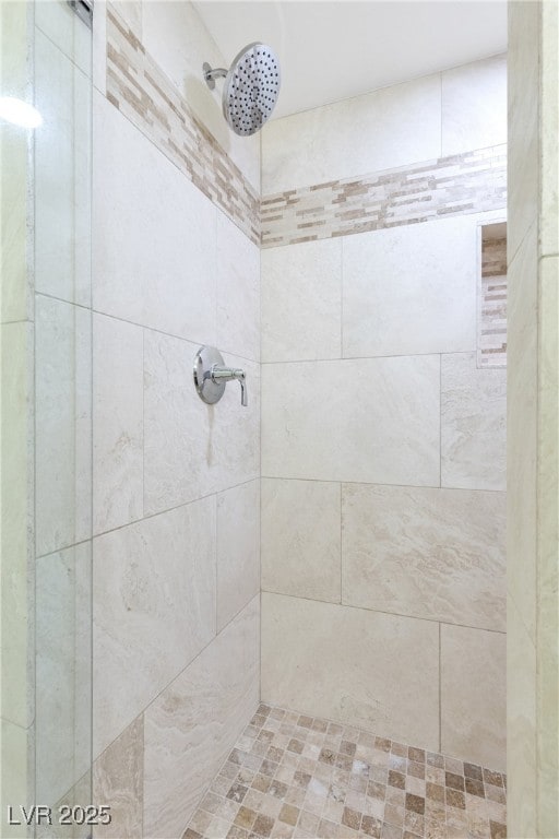 full bathroom with tiled shower