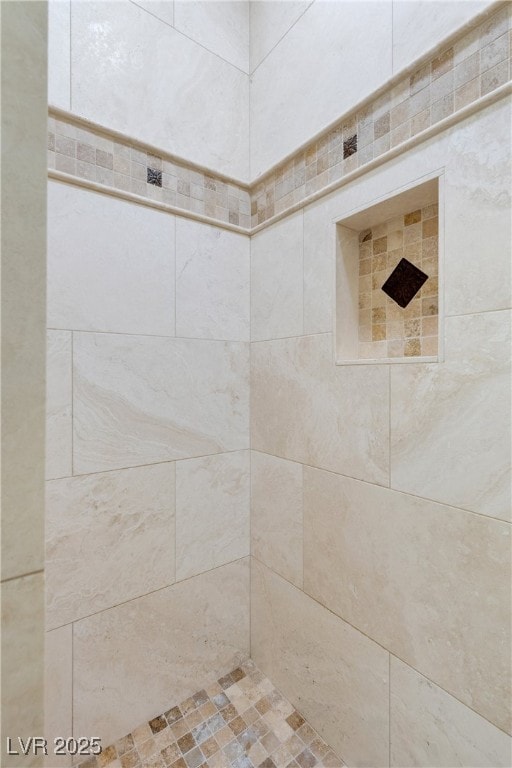 full bathroom with tiled shower