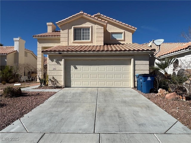 mediterranean / spanish-style home featuring driveway, a chimney, an attached garage, and stucco siding