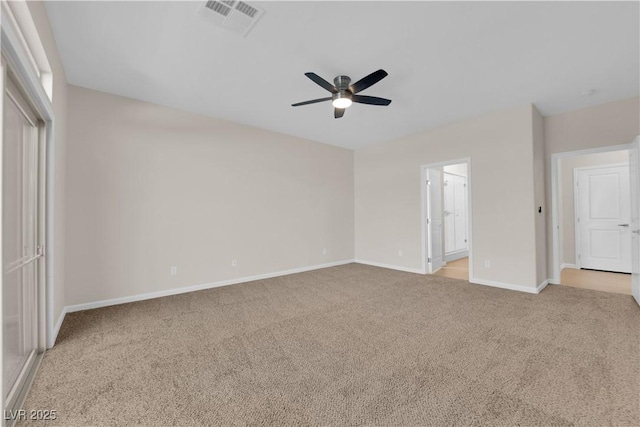 unfurnished bedroom with carpet, visible vents, connected bathroom, ceiling fan, and baseboards