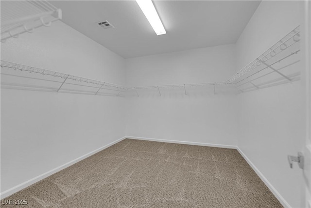 walk in closet with carpet floors and visible vents