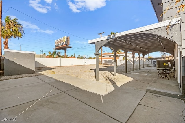 view of patio featuring fence