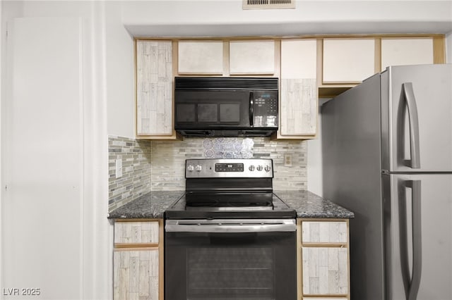 kitchen with appliances with stainless steel finishes, dark stone countertops, visible vents, and tasteful backsplash