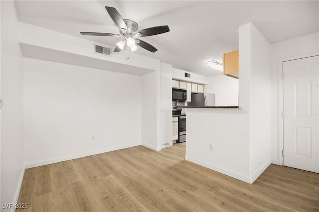 unfurnished living room with light wood-style flooring, visible vents, and baseboards