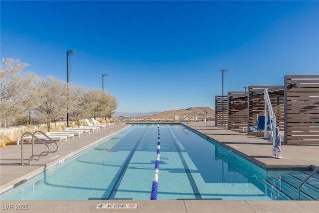 community pool featuring a patio area