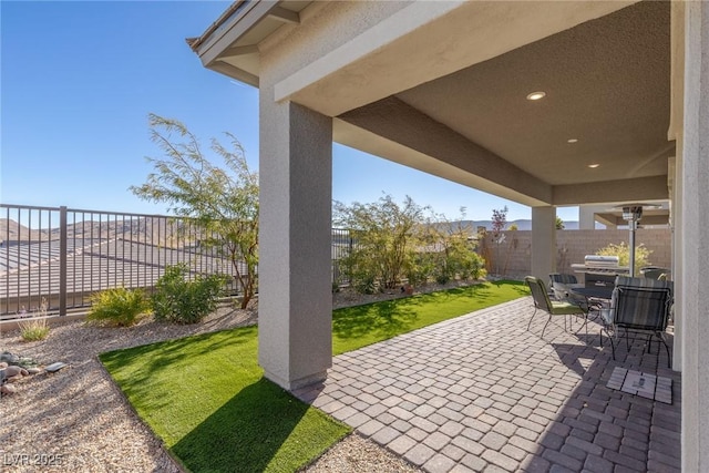 view of patio / terrace featuring grilling area and a fenced backyard